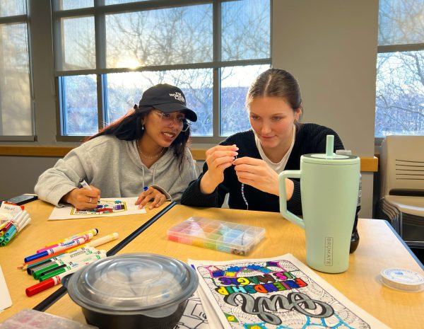 Abigail Adan, left, and Anna Gelfius participate in the Creating Connections event at the Student Center on Monday, Feb. 10, 2025. Adan and Gelfius helped coordinate the event along with Tyler Wurst, Director of the Office of Health, Promotion, and Wellness.