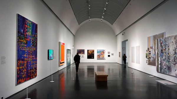 An museum-goer roams the main gallery of the Living End exhibit on Wednesday, Feb. 12, 2025. The exhibit was held at the Museum of Contemporary Art.