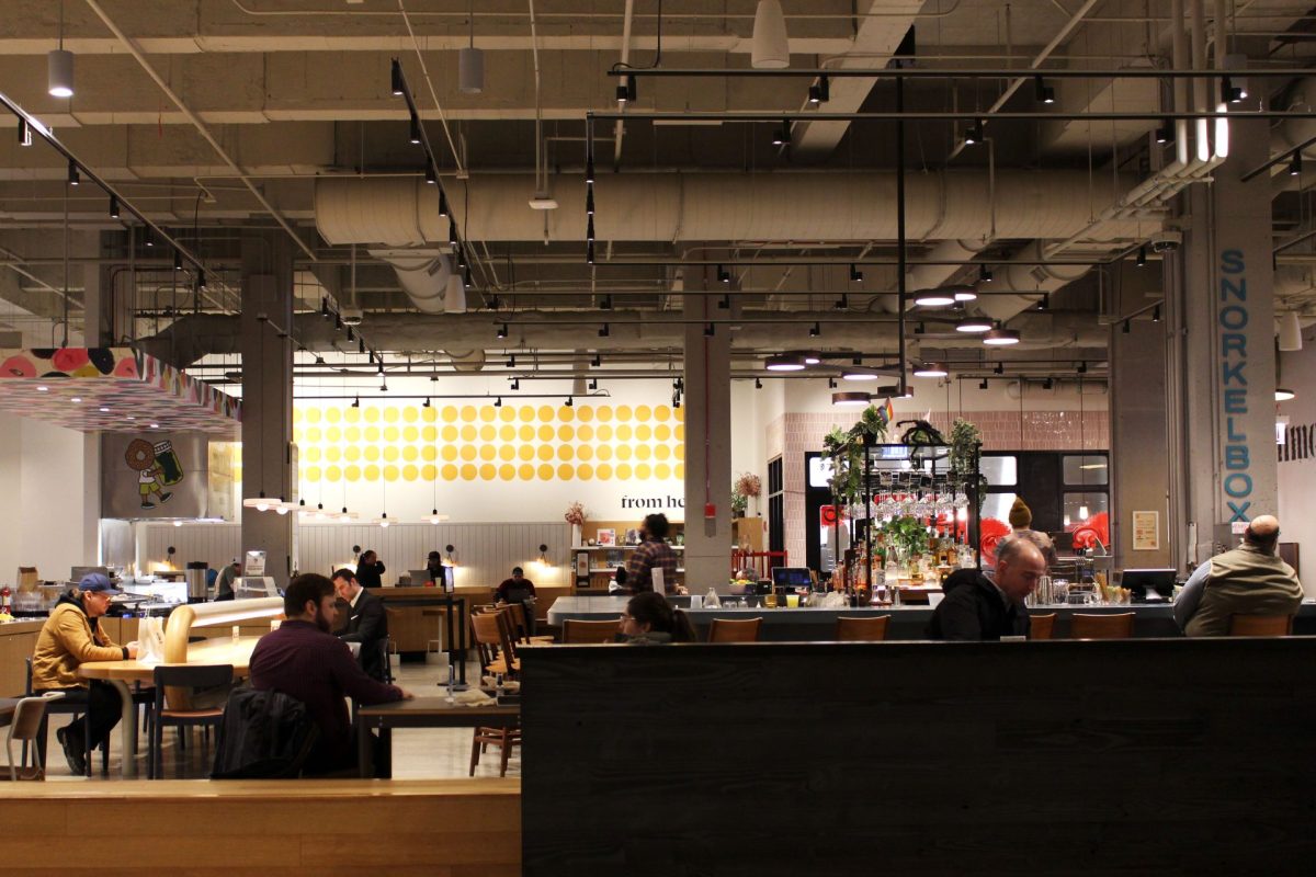 Patrons gather in the From Here On market in Chicago's West Loop on Thursday, Feb. 20, 2025. The market takes residence in Chicago's Old Post Office building, which underwent major renovations in 2019 to open it up to new tenants.