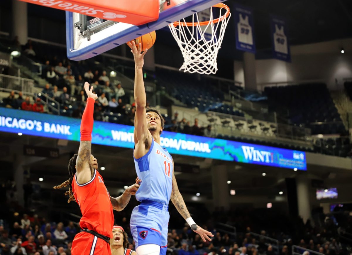 CJ Gunn throws up a shot on Wednesday, Feb. 19, 2025, at Wintrust Arena during the first half of DePaul's game against St. Johns. Before the game, Gunn averages the most points per game on DePaul with 12.3.