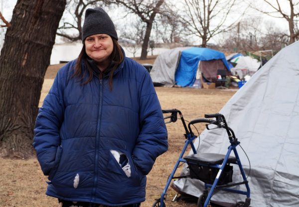 Amy Colucio stands by her tent in Uptown on Thursday, Jan. 30, 2025. Colucio and her sister have been living in a tent community since September 2024, after they were evicted from their apartment.