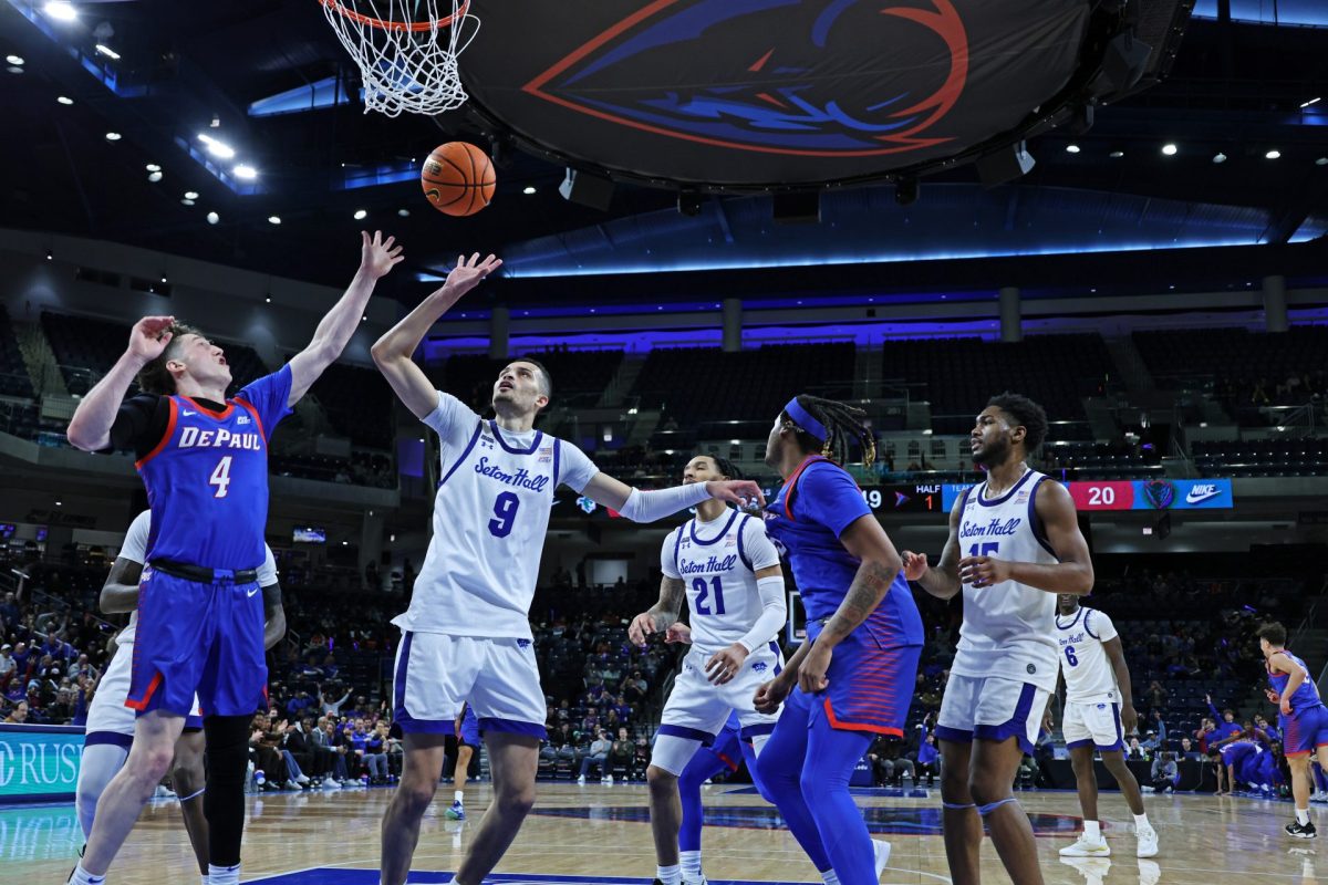 Conor Enright and Yacine Toumi compete for the ball during the first half of Sunday’s game at Wintrust Arena on Feb. 2, 2025. Conor Enright averages 4.9 assists per game against Big East opponents.