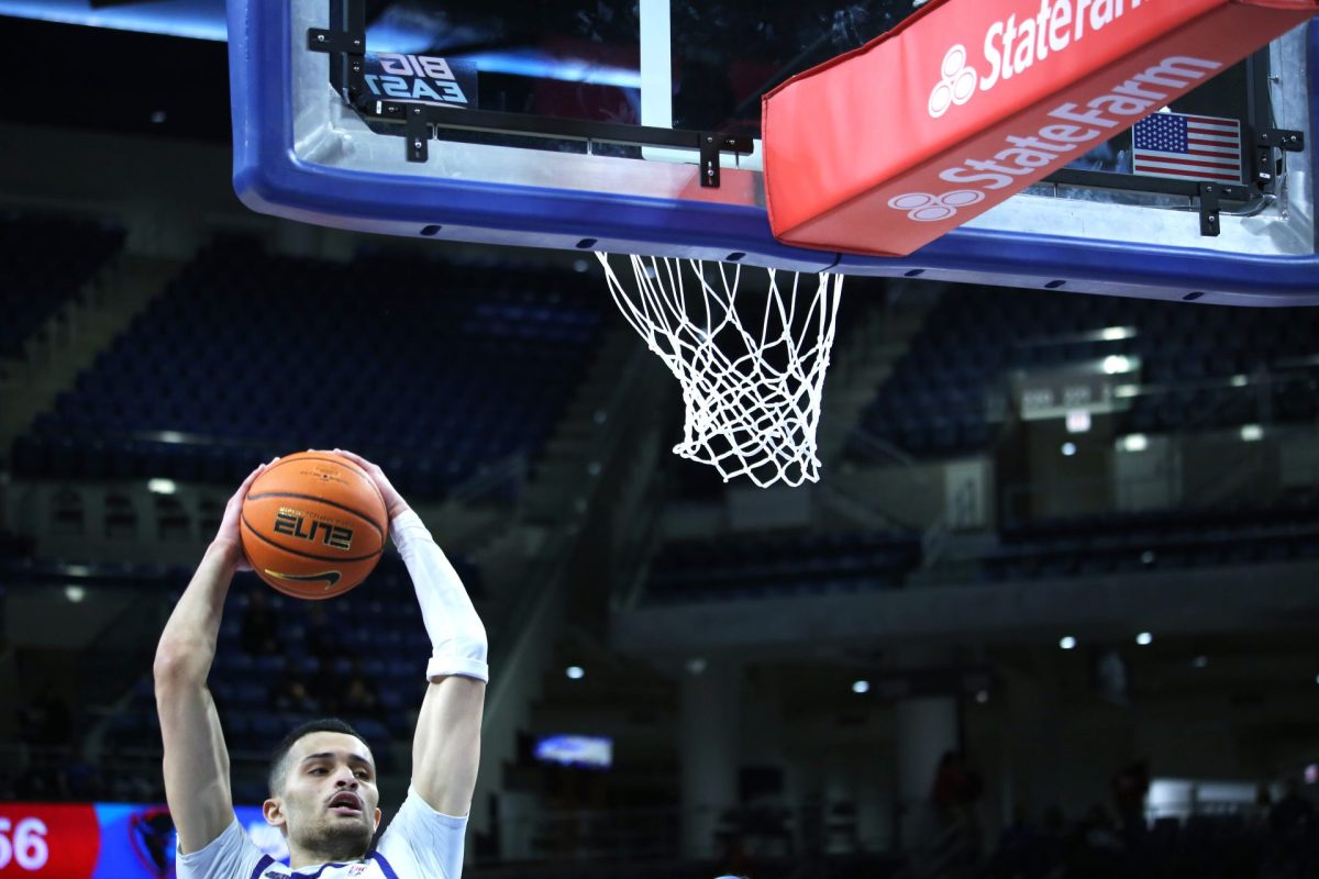 Yacine Toumi dunks the ball during the second half on Sunday, Feb. 2, 2025. Toumi averages 4.6 points per game.