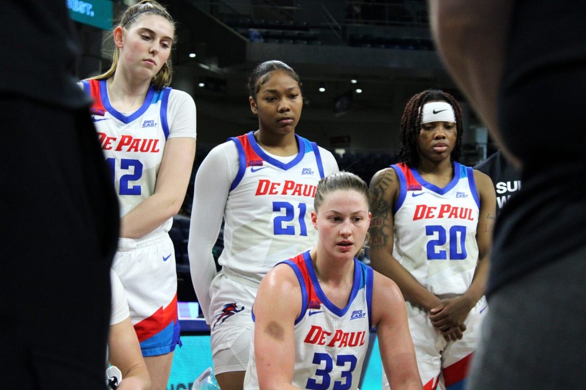 Members of the women's basketball team sit during a timeout in the second half against Seton Hall on Friday, Feb. 1, 2025. DePaul fell behind Seton Hall in the first half and trailed in points through the second half.