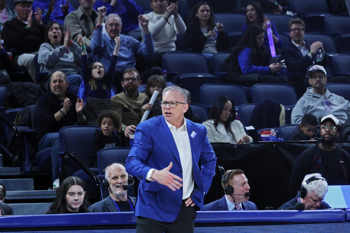 DePaul men's basketball head coach Chris Holtmann shouts from the bench during the second half on Sunday, Feb. 2, 2025. DePaul kept their lead during the second half.