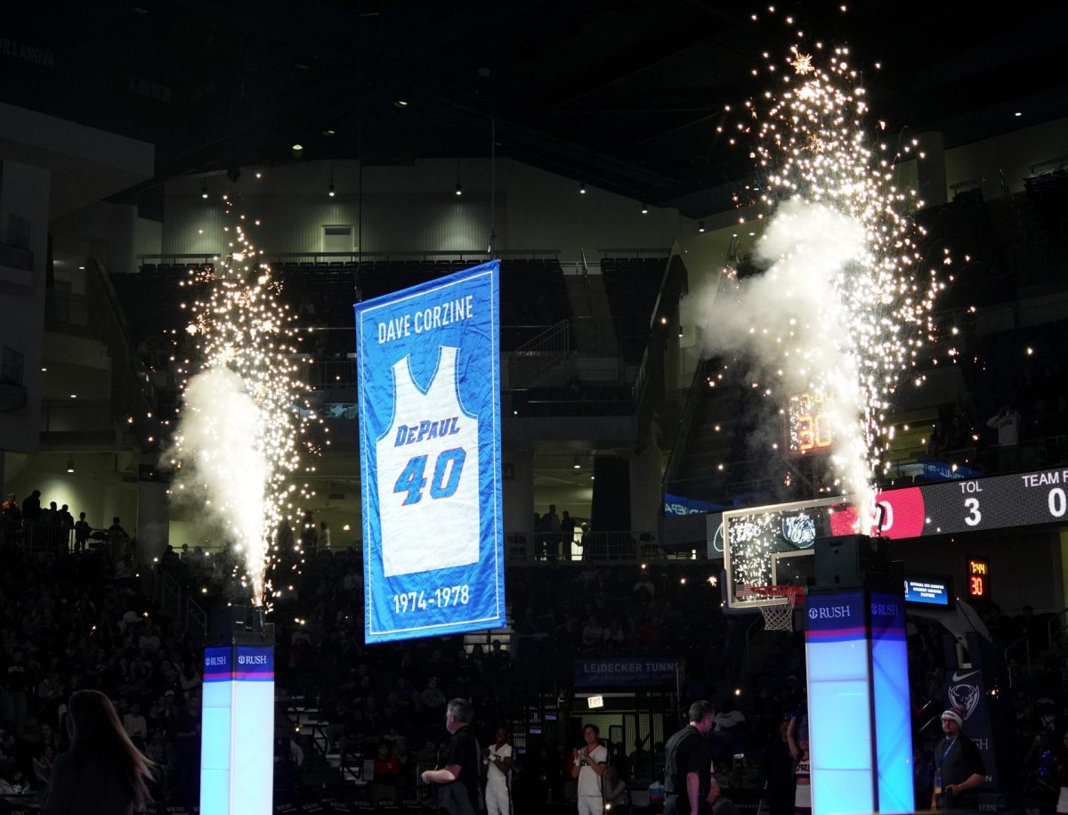 Dave Corzine’s jersey starts its journey into the rafters of Wintrust Arena on Saturday, Feb. 22, 2025. Corzine was honored during halftime of the game. 