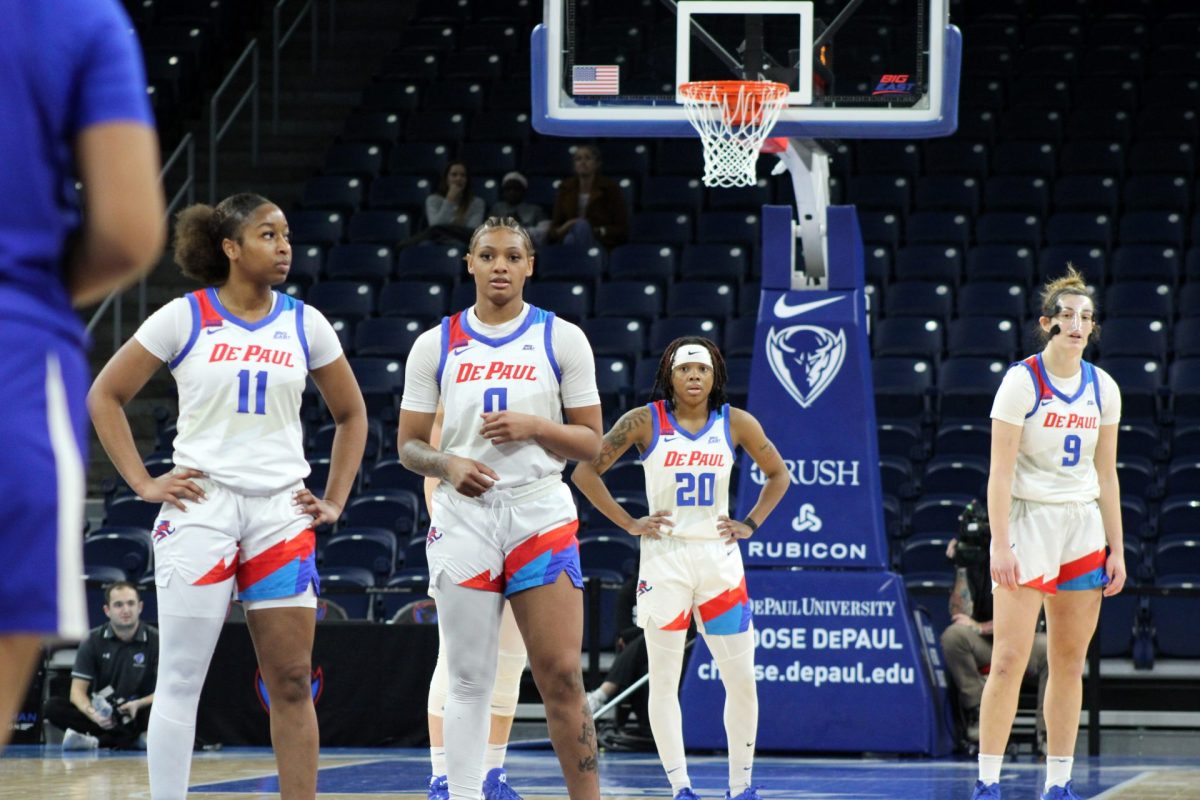 Members of the women's basketball team wait between plays at Wintrust Arena on Friday, Feb. 1, 2025. The team fell behind during the first half against Seton Hall.