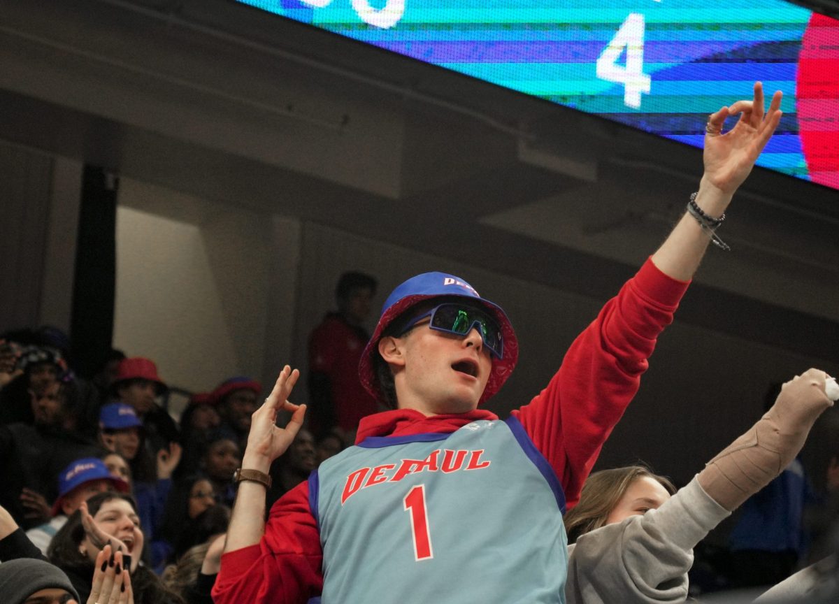 A DePaul fan celebrates in the student section on Wednesday, Feb. 5, 2025, at Wintrust Arena. The Wildcats lead 29-26 at the end of the first half. 