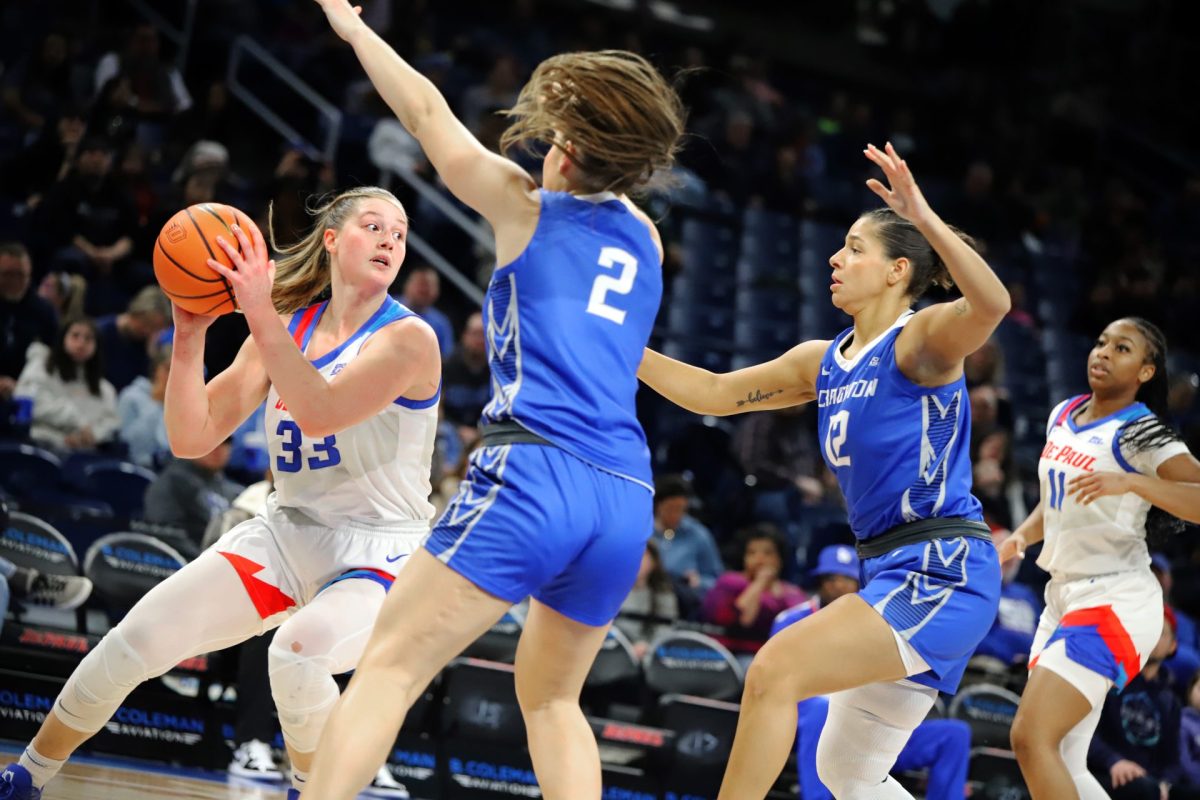 Jorie Allen looks for a pass while Kennedy Townsend and Jayme Horan block on Sunday, Feb. 23, 2025, at Wintrust Arena. Allen averages the most points per game on DePaul with 19.7.