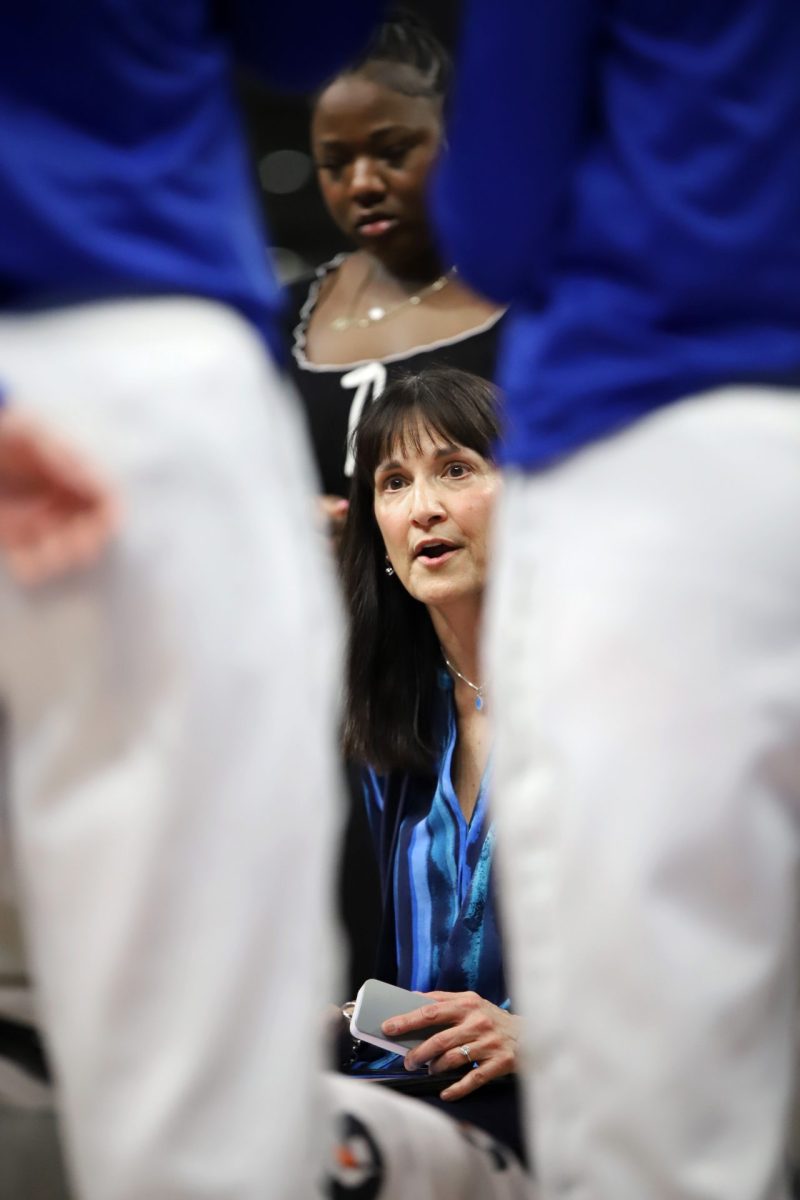 Jill Pizzotti talks to her team during a timeout on Sunday, Feb. 23, 2025, at Wintrust Arena. "It’s just going to be delayed a year, it’s not like we don’t have a lot of great things still to talk to recruits about," Pizzotti said, in reference to the delay of the basketball facility. 