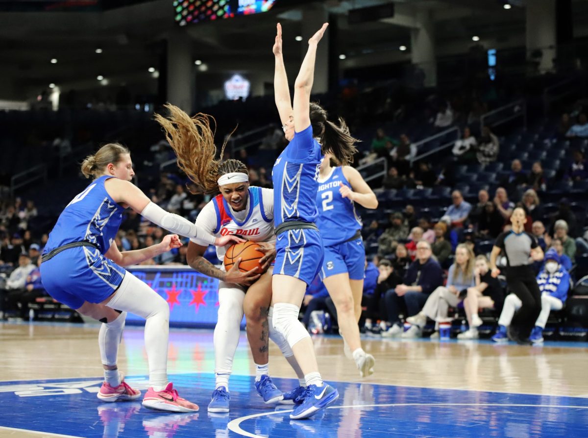 Taylor Johnson-Matthews fights for the ball against Creighton on Sunday, Feb. 23, 2025, at Wintrust Arena during the second half. Johnson-Matthews had another 26 point game. 