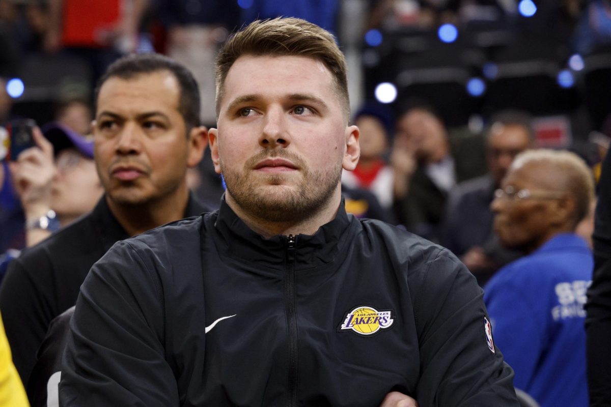 Los Angeles Lakers guard Luka Doncic sits on the bench before an NBA basketball game against the Los Angeles Clippers, Tuesday, Feb. 4, 2025, in Inglewood, Calif. 