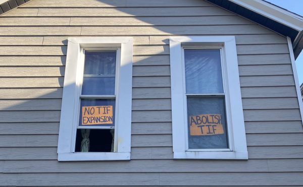 A sign saying ‘Abolish TIF’ is displayed on the window of Pilsen organizer, Leonardo Quintero on Nov. 12, 2024. Quintero has been living on Clipperton St his whole life.