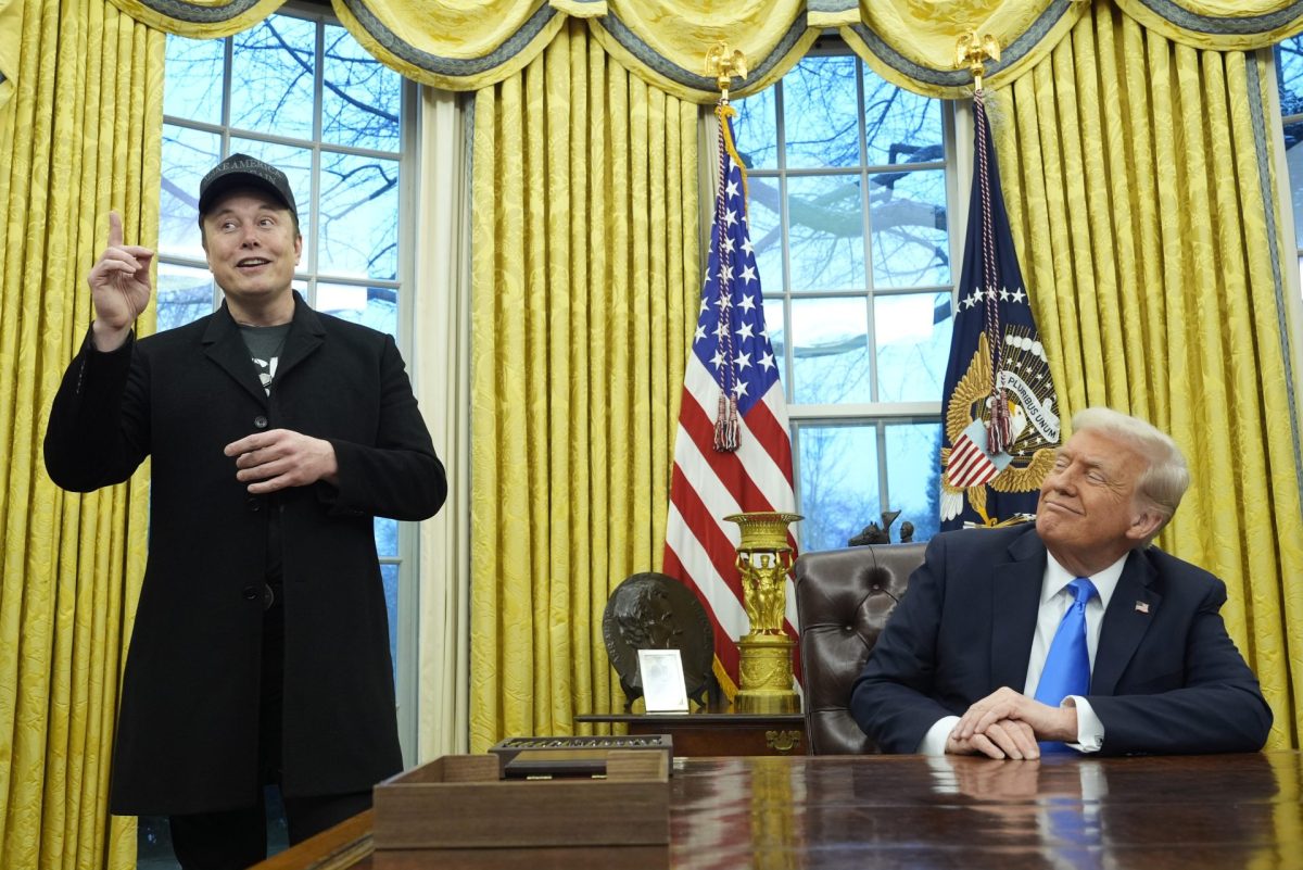 President Donald Trump listens as Elon Musk speaks in the Oval Office at the White House, Tuesday, Feb. 11, 2025, in Washington.