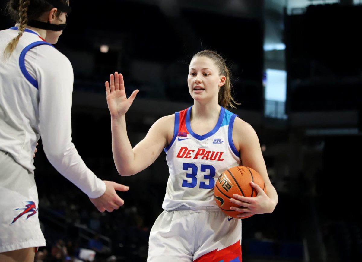 Jorie Allen goes to high-five Meg Newman during the second half of their game on Sunday, March 2, 2025, at Wintrust Arena. "My teammates and my coaches made me feel so special," Allen said. "I’m just really proud of what we’ve done this year.”