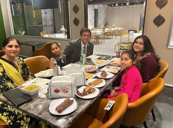 The Hajidamji family gathers around the table to enjoy Iftar on Saturday, March 23, 2024. Iftar is the meal that breaks the fast during Ramadan. (Photo provided by Sana Hajidamji)