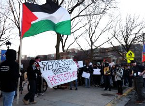 Organizers from Behind Enemy Lines and DePaul student protestors gather outside the DePaul University Quad on Thursday, March 6, 2025. The organization is banned from DePaul and are not allowed to be on campus grounds.