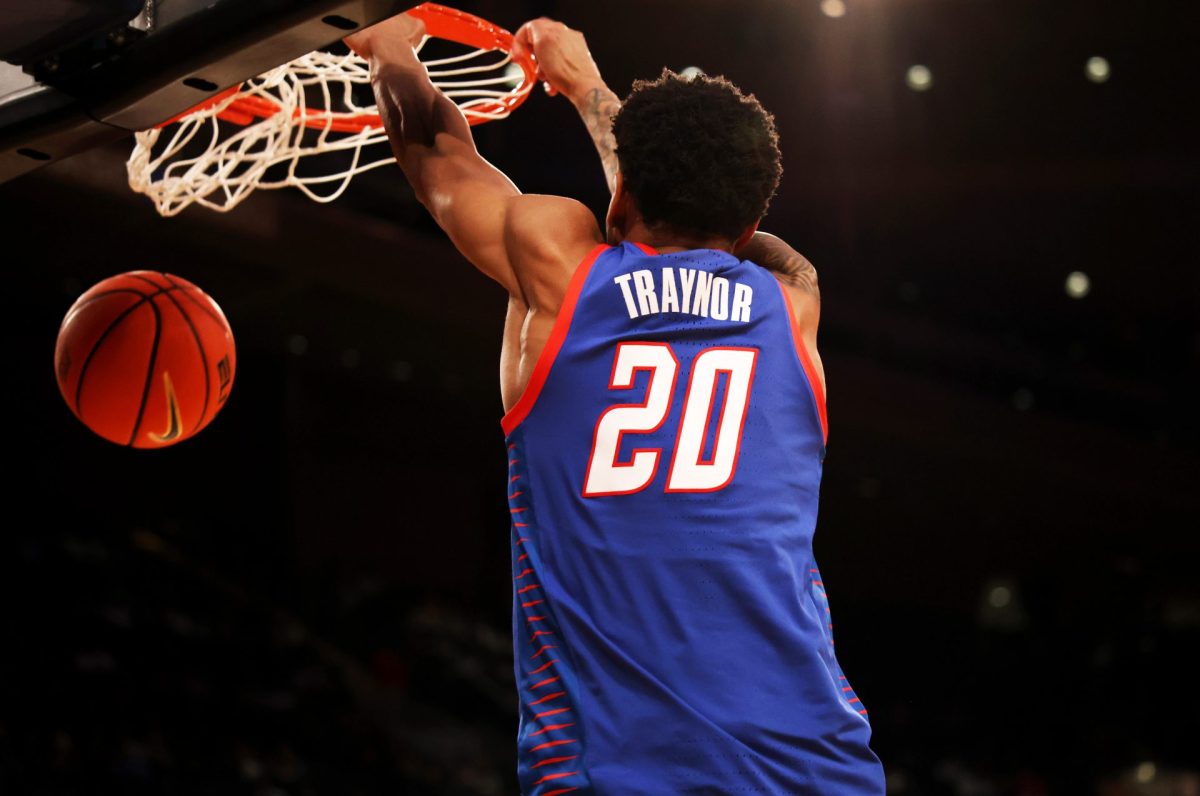 JJ Traynor hangs on to the basket after making a basket during the first half on Wednesday, March 12, 2025, at Madison Square Garden. DePaul is undefeated against Georgetown so far this season.