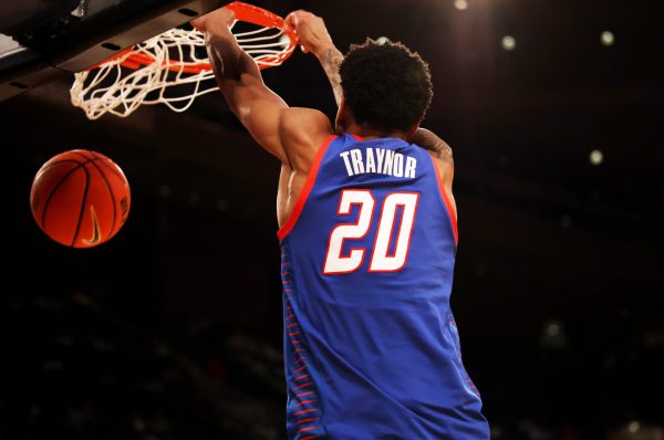 JJ Traynor hangs on to the basket after making a basket during the first half on Wednesday, March 12, 2025, at Madison Square Garden. DePaul is undefeated against Georgetown so far this season.