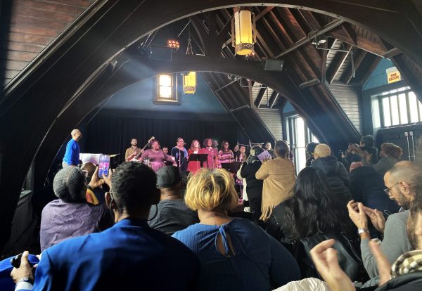 An audience gives a standing ovation to the Notes for Peace choir on Sun, Feb. 16, 2025. Notes for Peace is an organization which seeks to heal trauma through music. 