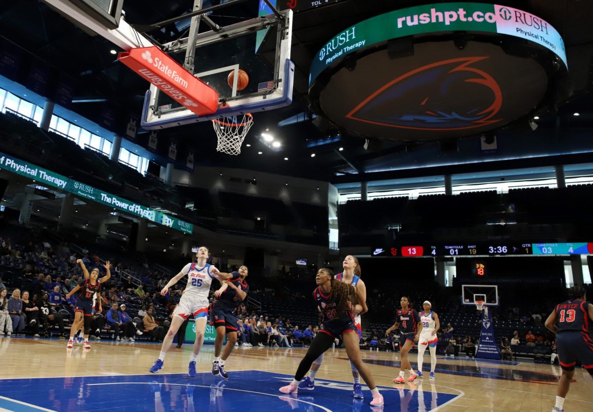 Kate Clarke and Jorie Allen watch the ball as it falls into the basket during the first half of DePaul's game against St. Johns on Sunday, March 2, 2025, at Wintrust Arena. Allen has started every regular season game.