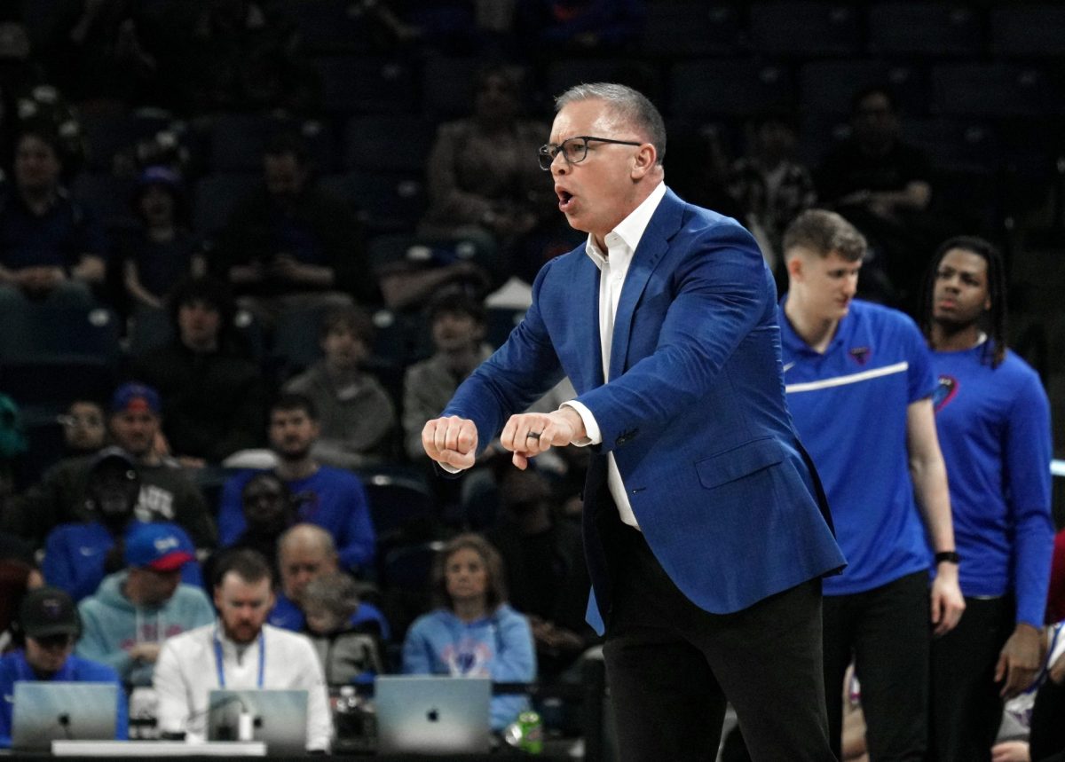 Chris Holtmann yells to his team during the first half on Saturday, March 8, 2025, at Wintrust Arena. DePaul ended the first half ahead, with a score of 38-36. 