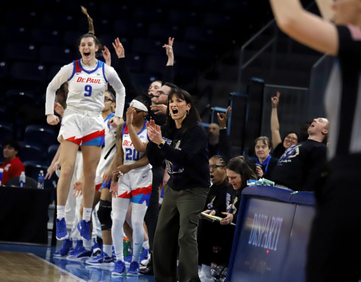 Jill Pizzotti and Meg Newman cheer on DePaul from the sidelines on Sunday, March 2, 2025, at Wintrust Arena. At halftime, the score of the game was 27-24, DePaul. 