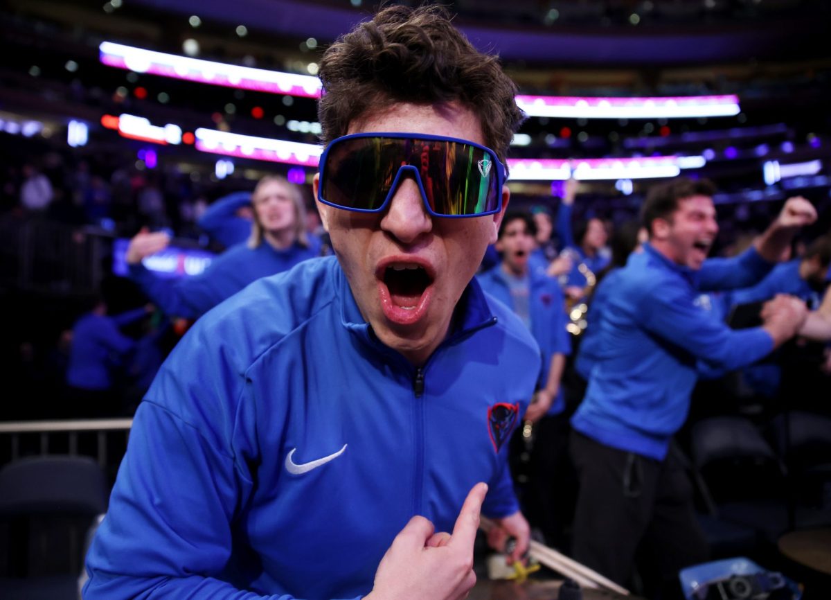 A DePaul fan motions to his gear on Wednesday, March 12, 2025, at Madison Square Garden. The Blue Demons won all three contests against Georgetown this season.