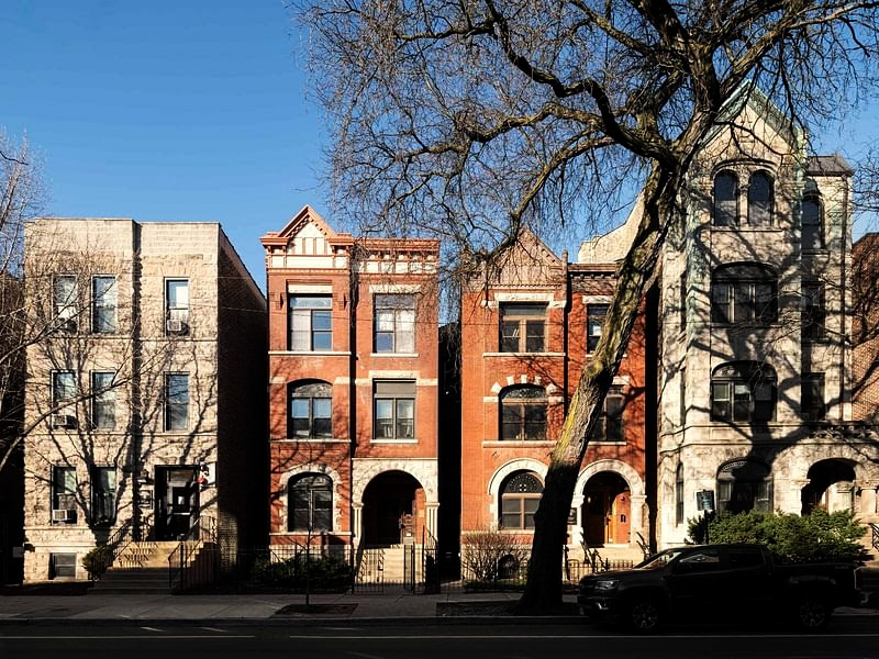 Four freestanding townhouses sit on the corner of  N. Sheffield and Belden Avenues. The house numbers are 2308, 2310, 2314 and 2316 and will be demolished for the new basketball facility.