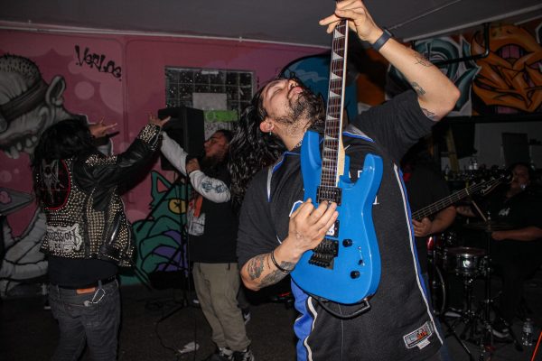 Through N Through guitarist Romario Gutierrez plays alongside vocalist Ruben L. Garza at the Metal Matinee at Work26 Skate Shop on Feb. 22, 2025. The space is open for local teens and artists to hang out, skate, and practice their music.