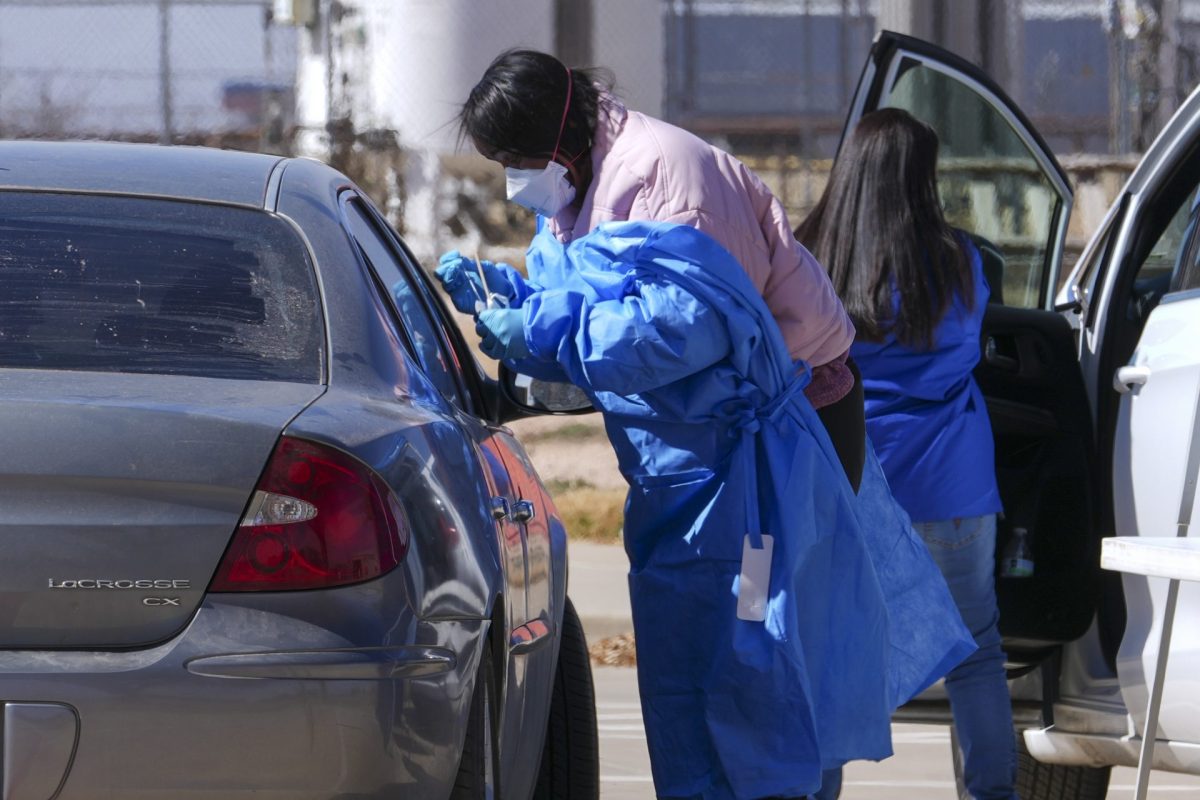 A health worker administers a measles test on Fernando Tarin, of Seagraves, Texas, at a mobile testing site outside Seminole Hospital District, Friday, Feb. 21, 2025, in Seminole, Texas