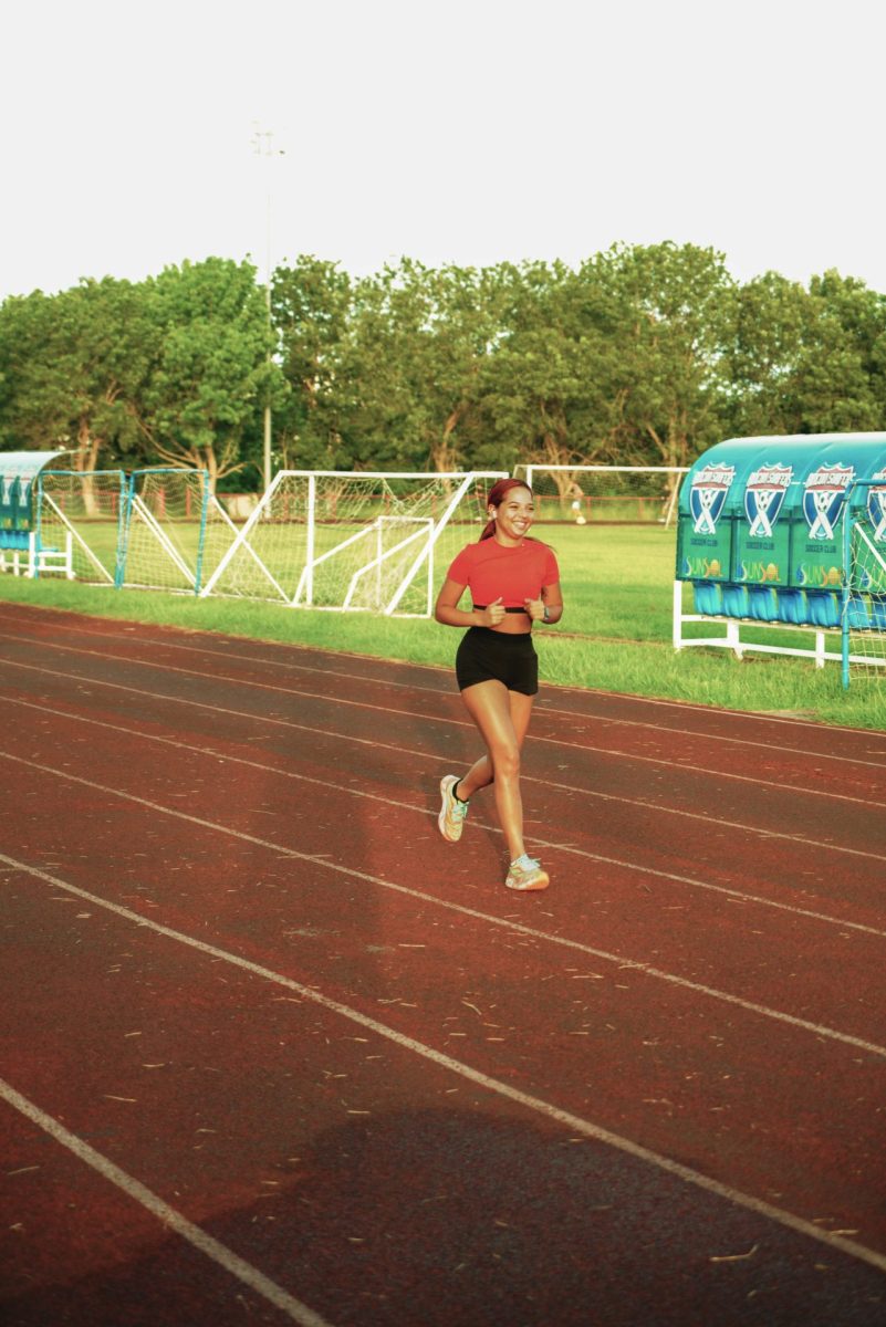 Laura Vázquez David runs through a track in Rincón, Puerto Rico on Friday, July 19, 2024. Vázquez David started running in June of last year as part of her training program.
