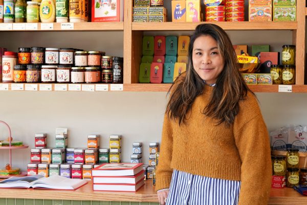 Mia Sakai, owner of Ándale Market, stands in front of her bodega-style shelves in her new Lincoln Park location on Saturday, April 12, 2025. Ándale Market houses everything from food, home, and body products, to essential products for pets.