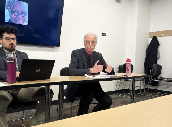Eugiene Beiriger discusses totalitarianism at the political science panel on Tuesday, April 15, 2025. During the conference, each of the panelists shared their personal insights on topics of immigration, political power and government systems.