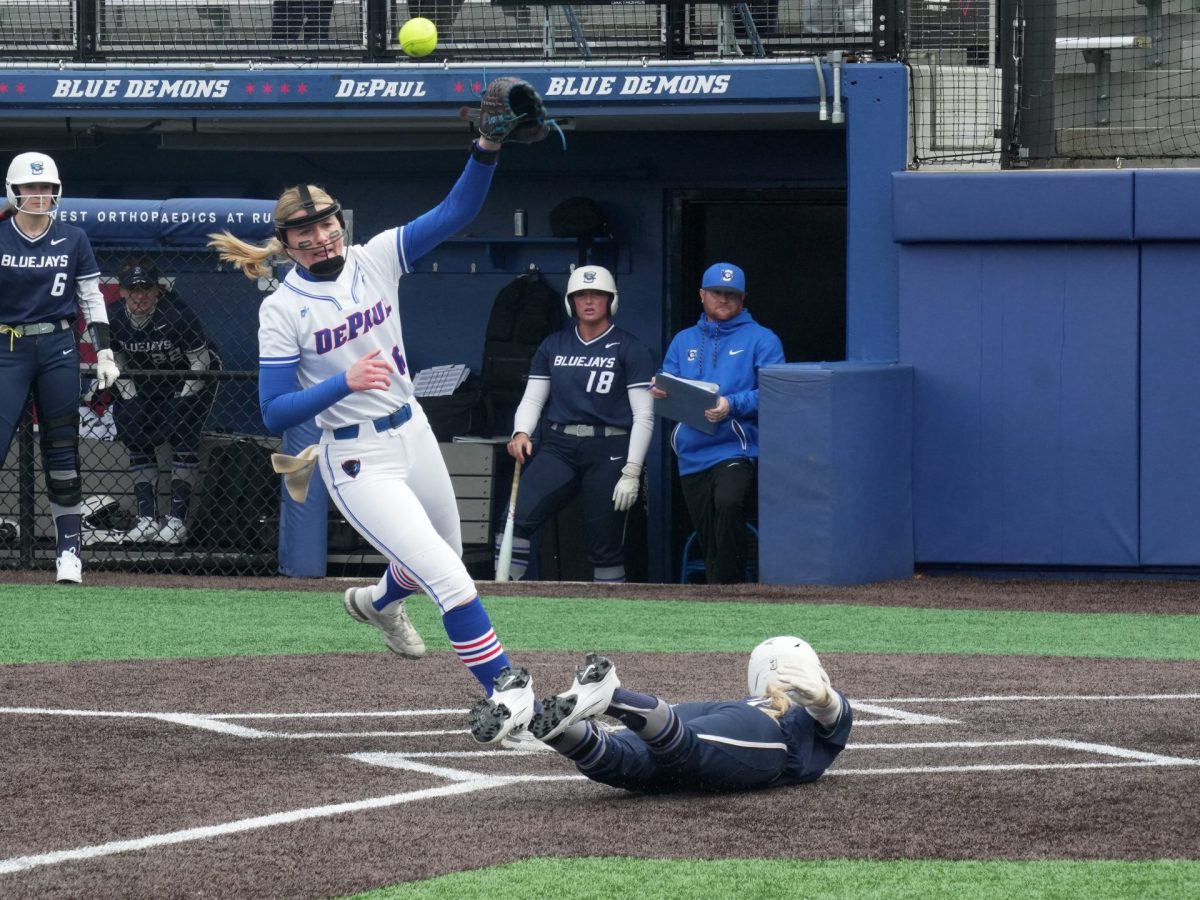 DePaul pitcher Bella Nigey attempts to tag out a scoring Creighton player on Friday, April 25, 2025, at Cacciatore Stadium. Nigey started the first two games of the weekend.