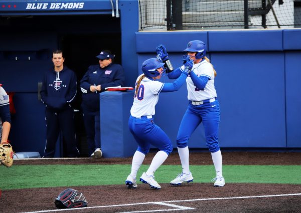 Brooke Cwick and Chelsea Parker celebrate a run on Tuesday, April 15, 2025, at Cacciatore Stadium. DePaul scored five runs in the fourth inning with Cwick and Parker each tallying hits.
