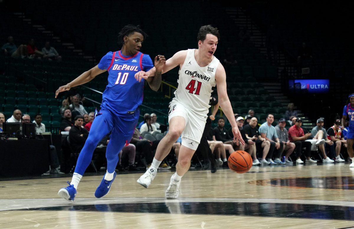 Simas Lukošius dribbles down the court while Chris Riddle tries to get in front on Tuesday, April 1, 2025, at MGM Grand Garden Arena. DePaul averages 72.8 points per game.
