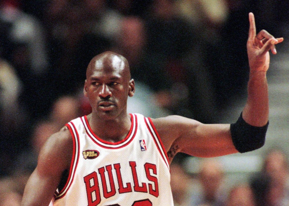 Chicago Bulls guard Michael Jordan signals to his teammates during the first quarter of Game 5 of the NBA finals in Chicago, Friday, June 12, 1998. 