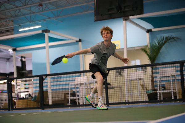 Matthew Chapin connects with the ball during pickleball practice on Monday, May 19, 2025, at Social Pickleball Fun in Lincoln Park. Chapin will take over the club's presidency role in the Fall.