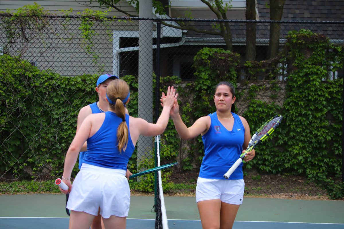 Sasha Stule high fives her teammate Eleanor Nobbs on Thursday, May 15, 2025, at Jonquil Park. DePaul lost to Villanova in the quarterfinals of the 2025 Big East Championship.