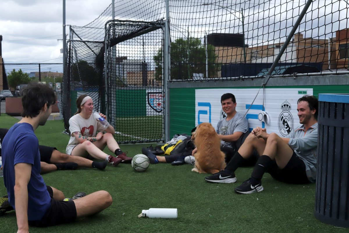 Helen Wargo and friends rest after playing soccer together in the early morning of Saturday, May 17, 2025 at Fleet Fields. Adult pickup games and weekly mini tournaments are often available to the public at Fleet Fields.