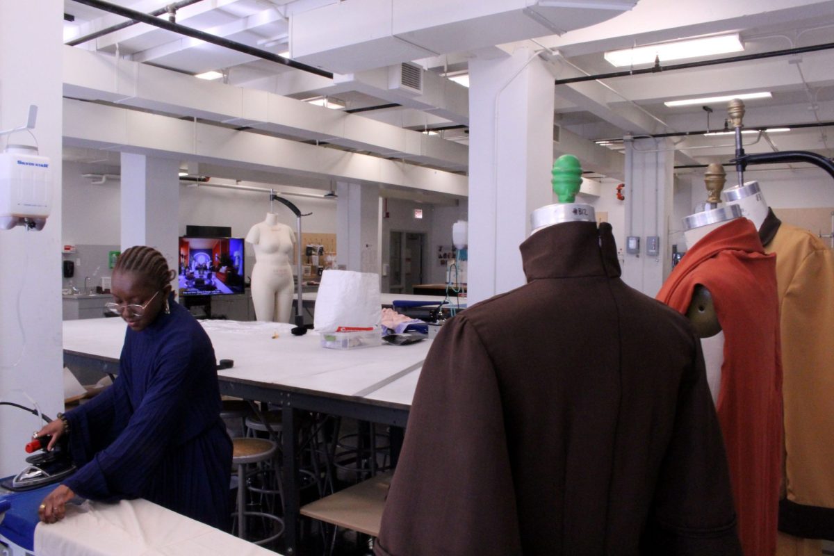 Shamya Banks, a fashion studies student at Columbia College of Chicago, irons linen fabric at the university's fashion lab on Friday, May 9, 2025. Banks is a recipient of the 2025 Virgil Abloh Post-Modern scholarship, a grant organized by the late creative director Virgil Abloh to aid Black students studying fashion.