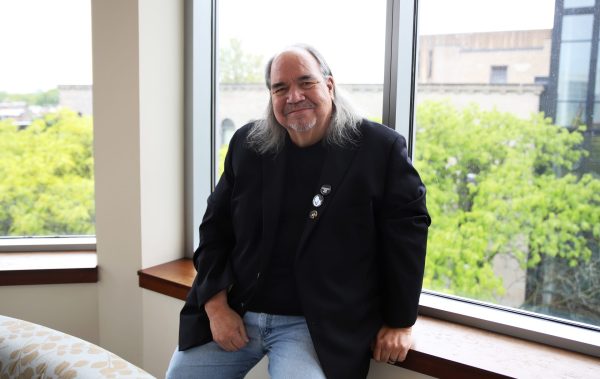 Professor Mark Turcotte sits for a photo in the Arts and Letters Hall on Wednesday, May 28, 2025. Turcotte likes to spend time outside after teaching his first class on Wednesday, in order to get fresh air.