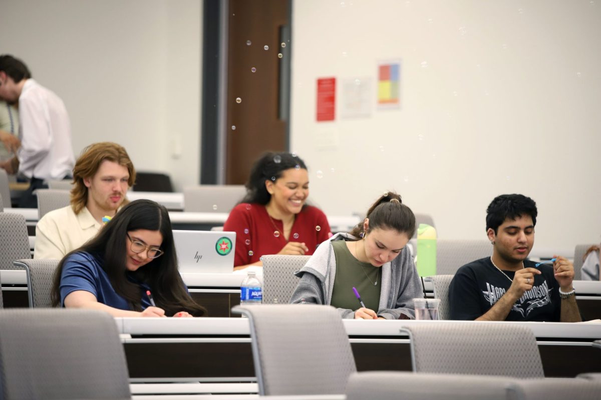 SGA member Isabella Simkus works with her fellow members at the general body meeting on Wednesday, May 14, 2025. SGA continues to work on initiatives for upcoming fall quarter.