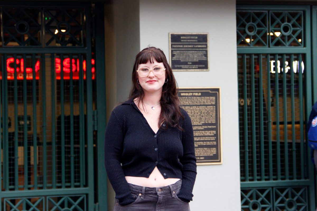 Emma Wilkie poses in front of Wrigley Field on May 30, 2025. Wilkie lives in Wrigleyville and is a former DePaul PRAD student.