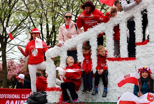 Parents take pictures of their children on a float representing the Juliusz Slowaczki Polish Parish School at the Polish Constitution Day Parade in Chicago on Saturday, May 3, 2025. For many years it has been tradition for Polish schools from the Chicagoland area to step out and celebrate the historical day. 