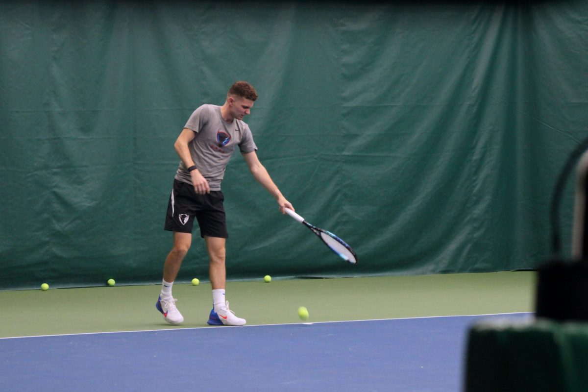 DePaul senior, Sven Moser, dribbles the ball with his racket before a serve on Thursday, May 8, 2025, at Lakeshore Sport and Fitness. Moser sustained a mid-foot sprain early this season that allows him to return for a fifth season in the fall.