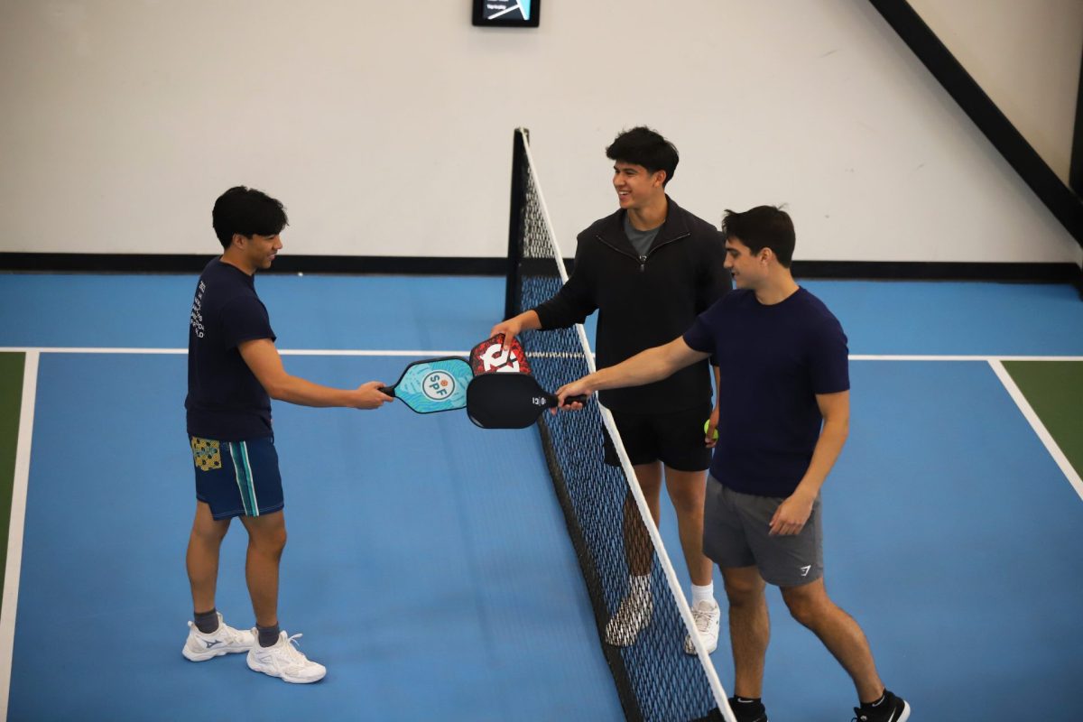 DePaul club pickleball players connect after a match on Monday, May 19, 2025, at Social Pickleball Fun in Lincoln Park. The club is finishing up its second year of operation at DePaul and is growing in membership.