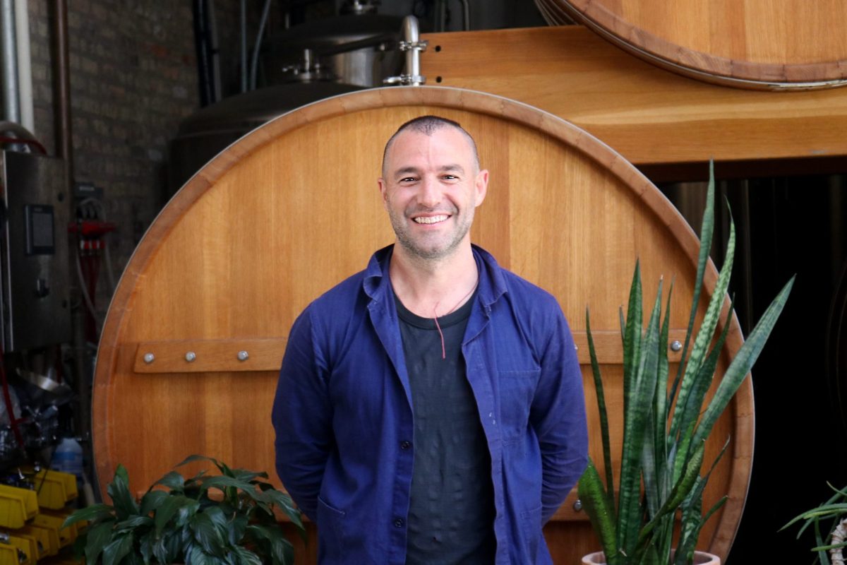 Co-founder of Middle Brow, Pete Ternes, stands in front of his beer barrels at Bungalow on Saturday, April 26, 2025. Ternes said the Trump tariff policies will raise their prices dramatically.