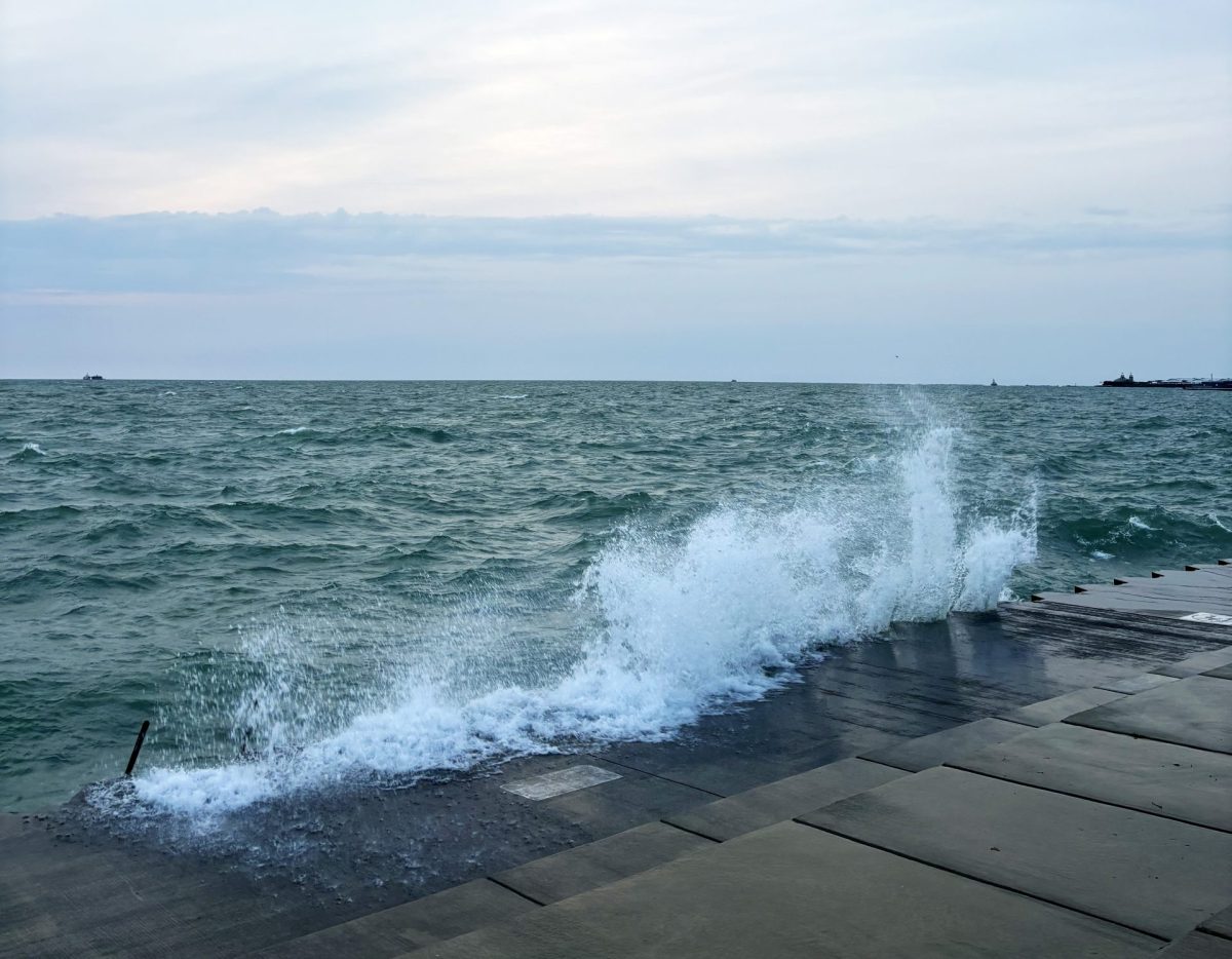Lake Michigan waves crash on Fullerton Beach at sunrise on October 12, 2024. Each year 11.6 million pounds of plastic is poured into the lake which serves as the main drinking water supply for the city.